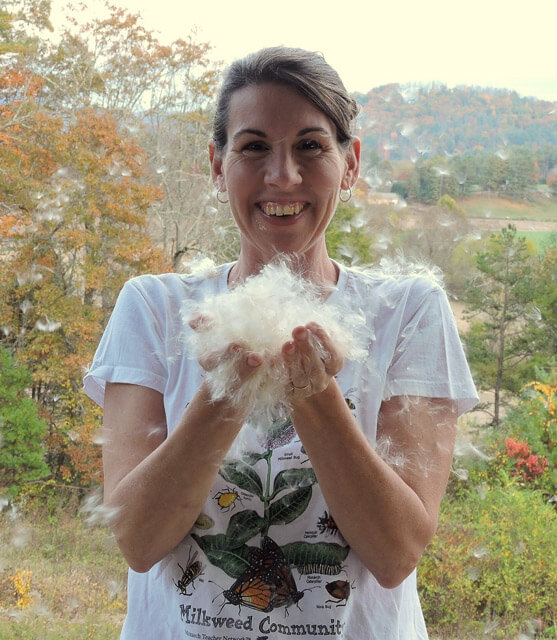 Kim with a handful of milkweed. Photo courtesy of Kim Bailey.