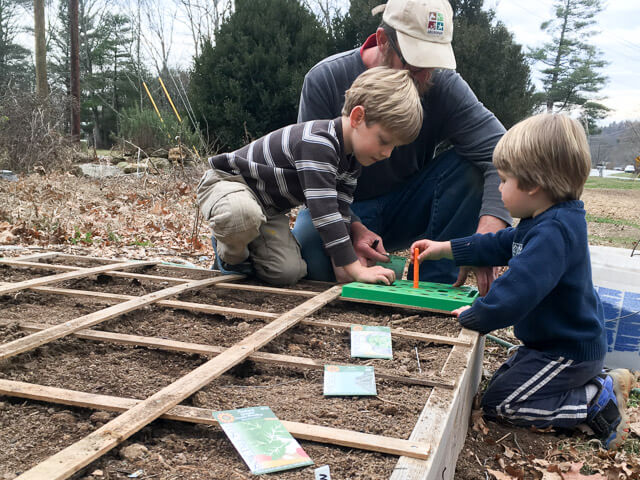 Colby and boys planting in early spring